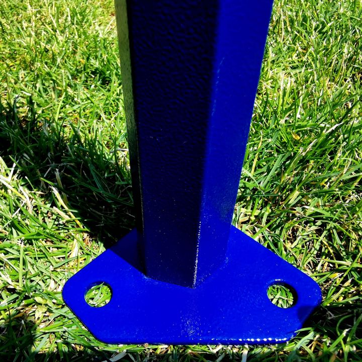 Detail of the blue tent base (foot) with attachment holes, standing on the grass.