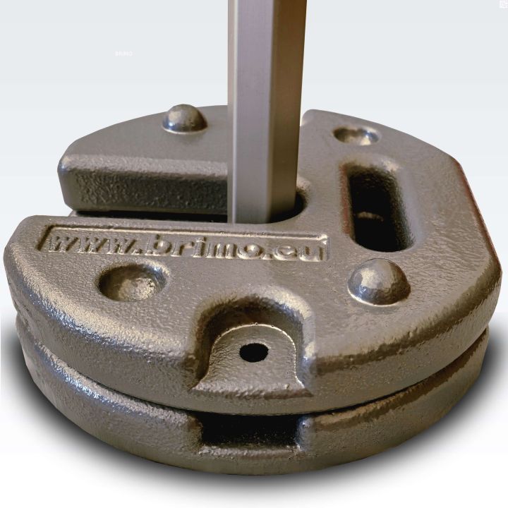 Two stackable steel weights placed on the leg of a scissor tent (close-up shot)